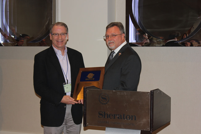 Photo: Joel Sprague receives the ASTM Award of Merit