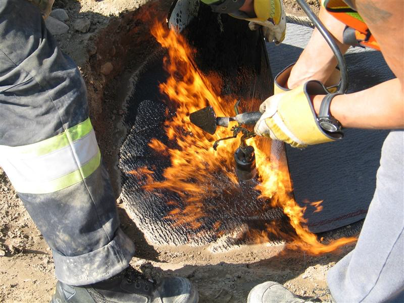 Figure 5 is a photo of torch work used to repair the geomembrane at the Arctic mine site