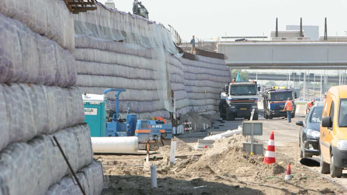 Highway retaining wall during construction - Image by NAUE Geosynthetics