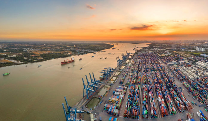 Top view aerial of Cat Lai container harbor, center Ho Chi Minh City, Vietnam with development buildings, transportation, energy power infrastructure. Photo by Hien Phung Thu via Shutterstock.